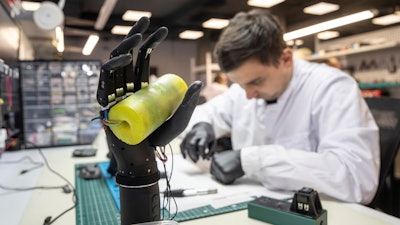 Engineer Oleksandr collects bionic prostheses for Ukrainian soldiers at the Esper Bionics office in Kyiv, Ukraine, Tuesday, Oct. 31, 2023. Ukrainian startup Esper Bionics began manufacturing bionic prostheses several years before Russia's invasion of Ukraine, primarily targeting the U.S. market. Nearly two years of the brutal war have significantly altered its product distribution, with 70% of the company's manufactured bionic hands now remaining in Ukraine.
