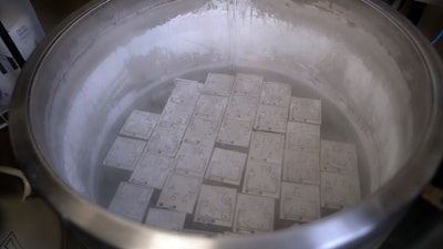 In this Tuesday, Oct. 2, 2018 photo, containers holding frozen embryos and sperm are stored in liquid nitrogen at a fertility clinic in Fort Myers, Fla.