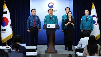 South Korean Interior and Safety Minister Lee Sang-min, center, speaks during a joint government briefing at the government complex in Seoul, South Korea, Wednesday, Feb. 21, 2024.