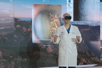 Tommy Korn, MD, board-certified ophthalmologist with Sharp Rees-Stealy Medical Group, demonstrates potential clinical uses of Apple’s new Vision Pro at Sharp’s Prebys Innovation and Education Center.