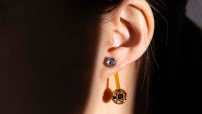 University of Washington researchers introduced the Thermal Earring, a wireless wearable that continuously monitors a user’s earlobe temperature. The smart earring prototype is about the size and weight of a small paperclip and has a 28-day battery life. The earring can be personalized with fashion designs made of resin or with a gemstone, without negatively affecting its accuracy.