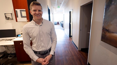 Optometrist Hunter Morgan poses in his offices on Friday, March 1, 2024, in Encinitas, Calif. When Morgan bought an optometry practice in San Diego three years ago, one of the first things he did was start accepting patients who were enrolled in Medicaid — the government-funded health insurance program for the poor and the disabled. Just five months later, Morgan said, he had to stop treating Medicaid patients because of the paltry pay. He charges $175 for eye exams, but the most he could get from Medicaid was about $40.