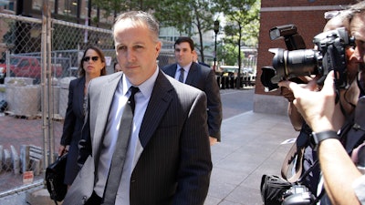 Barry Cadden, president of the New England Compounding Center, followed by members of his legal team, arrive at the federal courthouse for sentencing, June 26, 2017, in Boston.