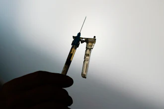 A syringe is prepared at a clinic in Norristown, Pa., Dec. 7, 2021. The Environmental Protection Agency finalized a rule Thursday, March 14, 2024, imposing stricter limits on a chemical used to sterilize medical equipment after finding a higher-than-expected cancer risk at facilities that use ethylene oxide to clean billions of devices including catheters and syringes.