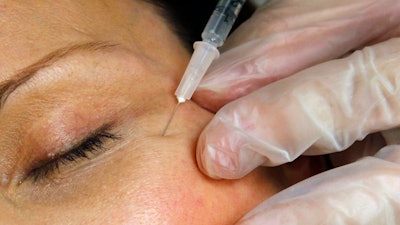 A patient receives a Botox injection at a clinic in Arlington, Va., on June 5, 2009. On Tuesday, April 23, 2024, the Centers for Disease Control and Prevention issued a warning about counterfeit Botox injections after more than 20 people got sick. All of the people told health officials that they got the shots from unlicensed individuals or in settings like homes or spas.