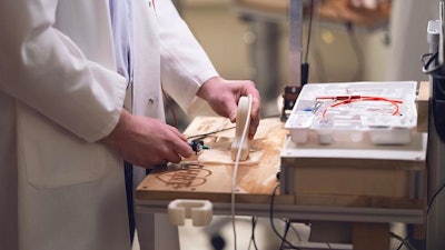 Penn State researchers developed a robotic simulation training programing, pictured here, that allows medical residents to practice placing central lines under a variety of scenarios and receive immediate feedback.