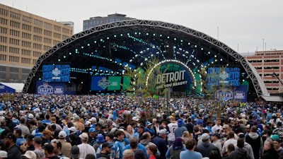 Crowds fill an area outside of the draft stage during the second round of the NFL football draft, Friday, April 26, 2024, in Detroit.