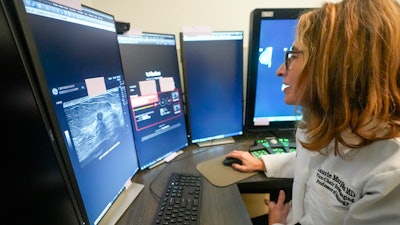Dr. Laurie Margolies demonstrates the Koios DS Smart Ultrasound software, Wednesday, May 8, 2024, at Mount Sinai hospital in New York. The breast imaging AI is used to get a second opinion on mammography ultrasounds. “I will tell patients, ‘I looked at it, and the computer looked at it, and we both agree,’” Margolies said. “Hearing me say that we both agree, I think that gives the patient an even greater level of confidence.”