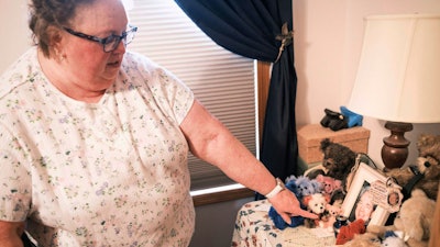 Nancy Gag Braun points to a small urn holding the ashes of her late husband Steve Braun, in her Mankato, Minn., bedroom on May 13, 2024. After caring for Steven at home became too much for her to handle, he was at the hospital while they waited on a long-term care placement. “I cried many nights,” Braun said. “I felt so guilty.”
