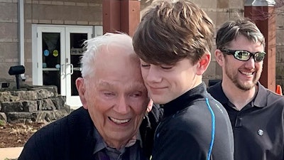 This photo provided by Linda Mitchelle shows Orville Allen of Poplar Bluff, Mo., hugging his great-grandson in March 2024. Allen died Wednesday, May 29, 2024, and his liver was successfully donated and transplanted to a 72-year-old woman. Transplant organizations say Allen is the oldest American ever to donate an organ upon death.