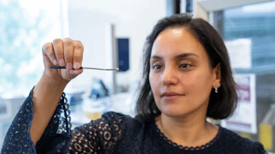 McMaster University researcher Zeinab Hosseinidoust holds an active phage sample stored in solid form.