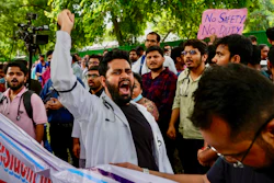 Doctors and paramedics protesting against the rape and killing of a trainee doctor at a government hospital in Kolkata gather in front of the Indian health minister's office, in New Delhi, India, Monday, Aug. 19, 2024.