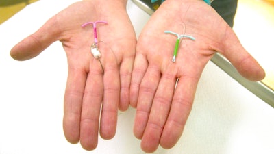 Dr. Susan Gorman displays the Skyla IUD, left, and the Mirena IUD, at High Lakes Gynecology in Redmond, Ore., Jan. 14, 2015.
