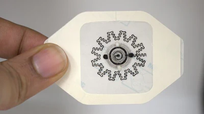 Photo of a water-powered, electronics-free dressing (WPED) for electrical stimulation of wounds.
