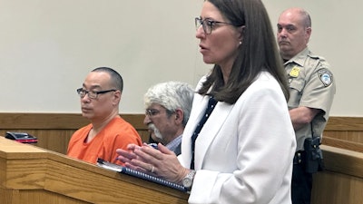 Glenn Chin, the pharmacist who supervised the Massachusetts lab responsible for the deaths of 11 Michigan residents, left, sits behind Michigan Assistant Attorney General Shawn Ryan, right, as she speaks in court, May 17, 2024, in Howell, Mich.