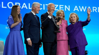President Joe Biden is presented with the Global Citizen Award by Chelsea Clinton, former President Bill Clinton, first lady Jill Biden and former Secretary of State Hillary Clinton at the Clinton Global Initiative Monday, Sept. 23, 2024, in New York.
