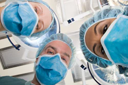 Surgeons looking down during surgery.