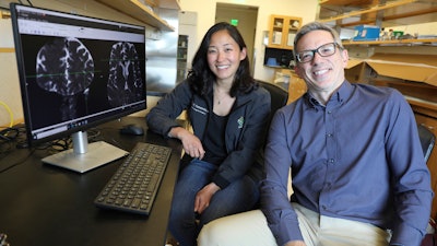 This undated photo provided by the Oregon Health & Science University in October 2024 shows Drs. Erin Yamamoto, left, and Juan Piantino, who used special imaging to spot a long-suspected pathway the human brain uses to clear waste.