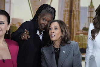 Democratic presidential nominee Vice President Kamala Harris chats with the hosts during a commercial break at The View, Tuesday, Oct. 8, 2024, in New York. From left are Ana Navarro, Whoopi Goldberg, Harris and Alyssa Farah Griffin.