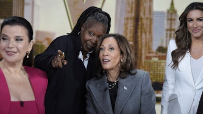Democratic presidential nominee Vice President Kamala Harris chats with the hosts during a commercial break at The View, Tuesday, Oct. 8, 2024, in New York. From left are Ana Navarro, Whoopi Goldberg, Harris and Alyssa Farah Griffin.