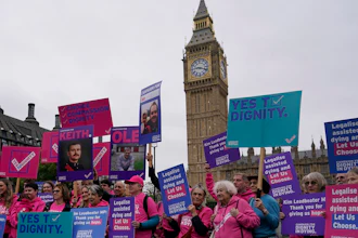 A small demonstration by people advocating assisted dying hold a protest outside the Hoses of Parliament as a bill to legalise assisted dying is to be put before lawmakers in London, England, Wednesday, Oct. 16, 2024.