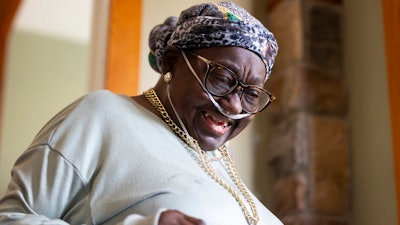 Patricia Johnican smiles as she greets a friend at Commons of Grace Senior on Wednesday, Sept. 25, 2024, in Houston.