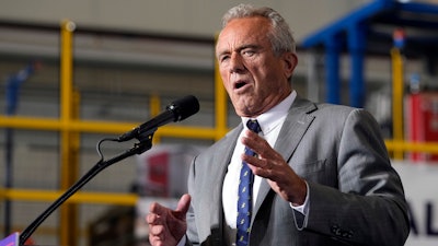 Robert F. Kennedy, Jr., speaks before Republican presidential nominee former President Donald Trump at a campaign event, Sept. 27, 2024 in Walker, Mich.