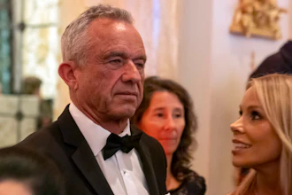 Robert F. Kennedy Jr., and his wife Cheryl Hines arrive before President-elect Donald Trump speaks during an America First Policy Institute gala at his Mar-a-Lago estate, Thursday, Nov. 14, 2024, in Palm Beach, Fla.