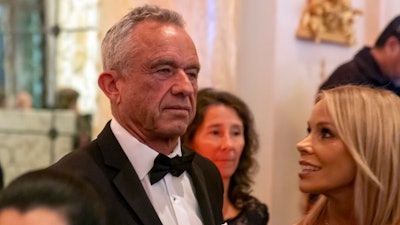 Robert F. Kennedy Jr., and his wife Cheryl Hines arrive before President-elect Donald Trump speaks during an America First Policy Institute gala at his Mar-a-Lago estate, Thursday, Nov. 14, 2024, in Palm Beach, Fla.
