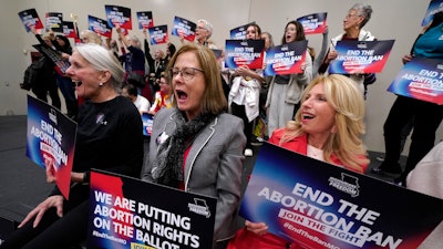Missouri residents and abortion-rights advocation react to a speaker during Missourians for Constitutionals Freedom kick-off petition drive, Feb. 6, 2024 in Kansas City, Mo. Abortion-rights advocates will ask a judge Wednesday, Dec. 4, 2024 to overturn Missouri’s near-total ban on the procedure, less than a month after voters backed an abortion-rights constitutional amendment.