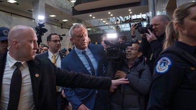 Robert F. Kennedy Jr., President-elect Donald Trump's nominee to be Secretary of Health and Human Services, arrives at the Hart Building to meet with senators at the Capitol in Washington, Monday, Dec. 16, 2024.