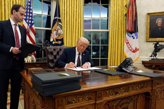 President Donald Trump signs an executive order withdrawing the U.S. from the World Health Organization in the Oval Office of the White House, Monday, Jan. 20, 2025, in Washington.