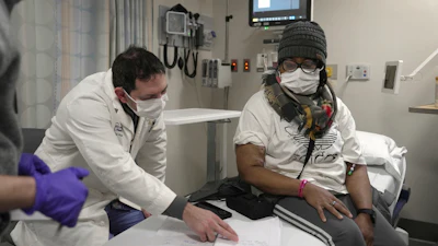 Towana Looney, who received a pig kidney transplant in November 2024, goes over notes about her recovery with Dr. Jeffrey Stern at NYU Langone Health in New York, Friday, Jan. 24, 2025.