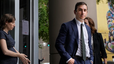 Dr. Eithan Haim walks out of the Bob Casey United States Courthouse after appearing for an arraignment hearing, June 17, 2024, in Houston.