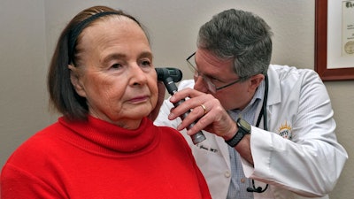 Dr. Lee Gross examines patient Annie Geisel at the Epiphany Health Direct Primary Care Tuesday, Jan. 21, 2025, in Port Charlotte, Fla.