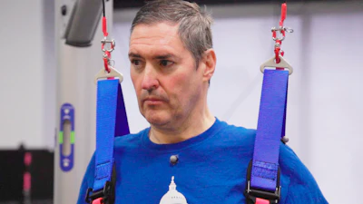 This image from video provided by UPMC and University of Pittsburgh Health Sciences shows Doug McCullough, who has spinal muscular atrophy, during tests of experimental spinal cord stimulation to improve muscle function in Pittsburgh, on March 14, 2023.