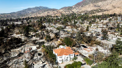 A lone home stands among residences levelled by the Eaton Fire in Altadena, Calif., on Tuesday, Jan. 21, 2025.