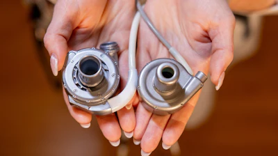 An educator demonstrates the HeartMate 3 Left Ventricular Assist System (left) and BrioVAD System (right).