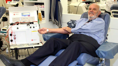 In this May, 2011, photo provided by Australian Red Cross Lifeblood donor James Harrison, credited with saving 2.4 million babies through his record-breaking blood plasma donations over decades, is giving blood at donation center in Sydney.