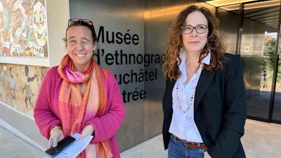 Marianne de Reynier Nevsky, the cultural mediation manager in Neuchatel, left, and town council member Julie Courcier Delafontaine chat about a new 'museum prescription' program outside the Ethnographic Museum of Neuchatel in Neuchatel, Switzerland, Wednesday, March 19, 2025.