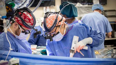 Brandon Petree, MD, and Caitlin Demarest, MD, PhD, operate on a patient during a recent double lung transplant.