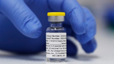 A vial of the Phase 3 Novavax coronavirus vaccine prepared for use in a trial at St. George's University hospital in London, Oct. 7, 2020.