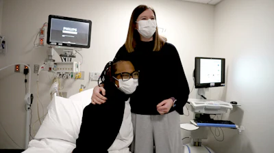 Pig kidney transplant recipient Towana Looney sits with transplant surgeon Dr. Jayme Locke on Dec. 10, 2024, at NYU Langone Health in New York.