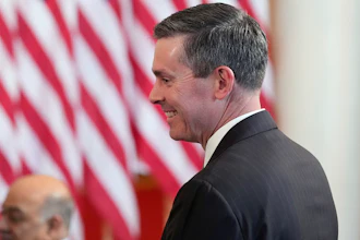 Eli Lilly and Company CEO David Ricks stands as President Donald Trump speaks about investing in America in the Cross Hall of the White House, Wednesday, April 30, 2025, in Washington.