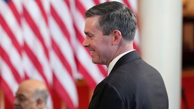 Eli Lilly and Company CEO David Ricks stands as President Donald Trump speaks about investing in America in the Cross Hall of the White House, Wednesday, April 30, 2025, in Washington.
