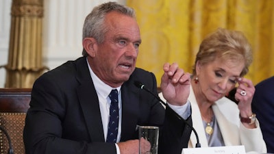 Health and Human Services Secretary Robert F. Kennedy Jr. speaks as Education Secretary Linda McMahon listens during a Make America Healthy Again (MAHA) Commission Event in the East Room of the White House, Thursday, May 22, 2025, in Washington.