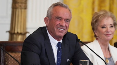 Health and Human Services Secretary Robert F. Kennedy Jr., left, and Education Secretary Linda McMahon attend a Make America Healthy Again (MAHA) Commission Event in the East Room of the White House, Thursday, May 22, 2025, in Washington.