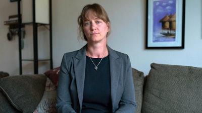 Jenna Norton ,who works as a researcher at the NIH, poses for a photograph during an interview with the Associated Press in Bethesda, Md., Friday, June 6, 2025.