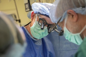 This photo provided by DukeHealth shows surgeon Joseph Turek during pediatric heart surgery in Durham, N.C., in 2021.
