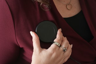 Brandy Ellis charges a pacemaker-like device that was installed in her chest as part of an experimental treatment for depression, on Thursday, July 24, 2025, in Delray Beach, Fla.